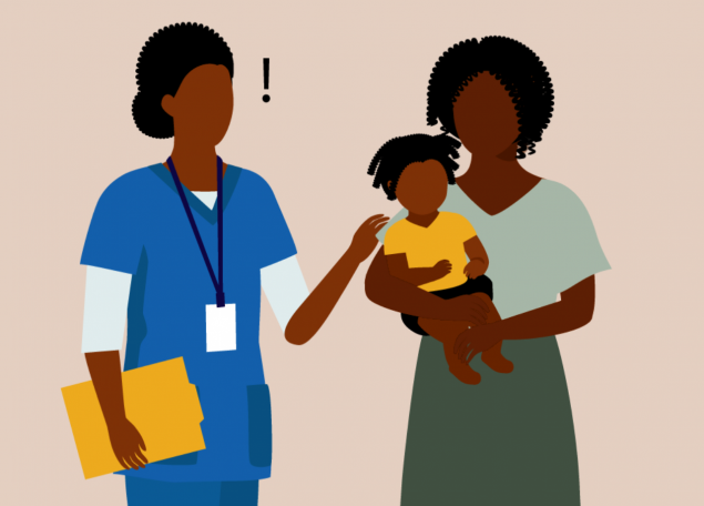 A nurse in a blue smock with a badge talking to a mother with a baby.