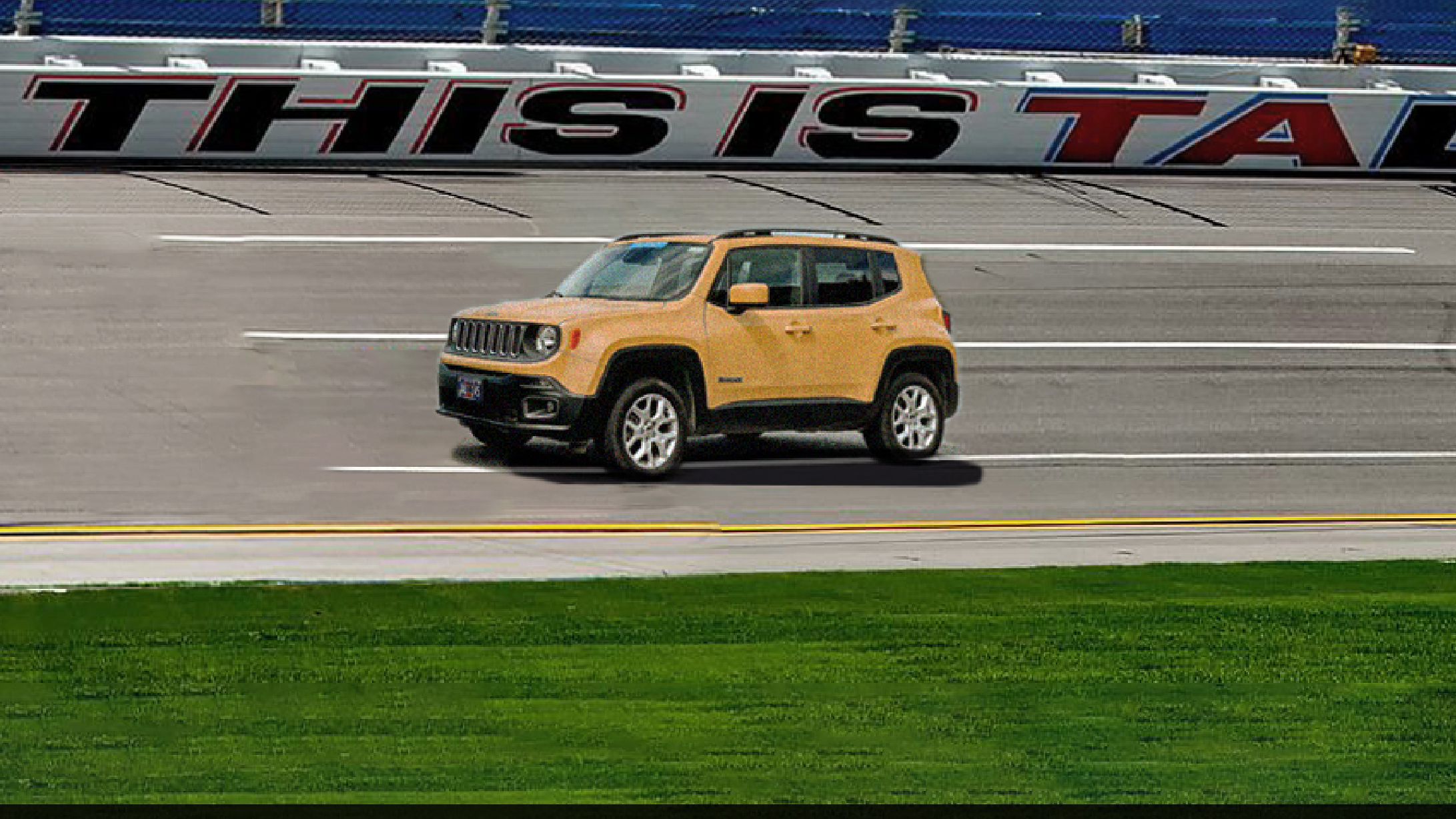 Yellow SUV on the racetrack at Talledega Super Speedway.