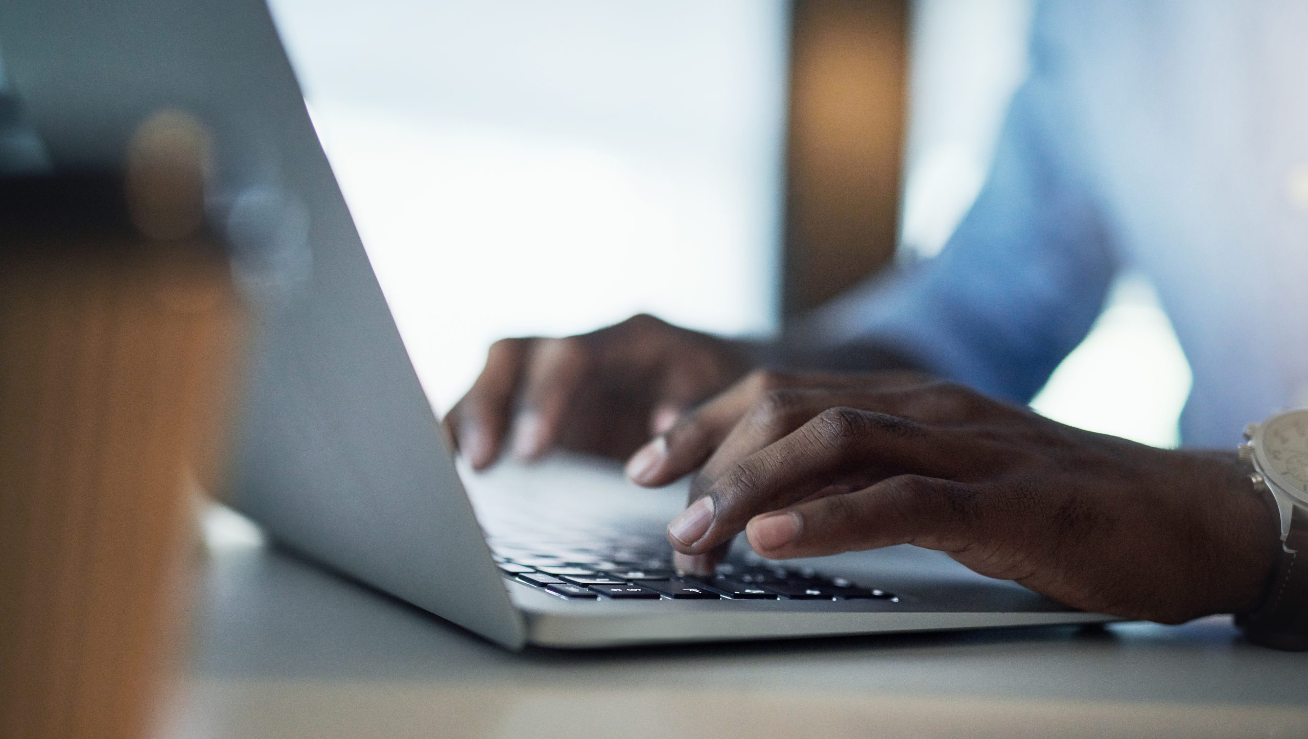 Photo of a hands at a laptop