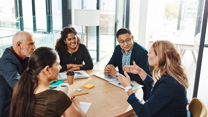 People working collaboratively at a table.