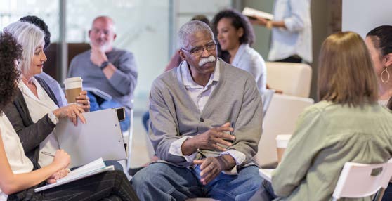 a group of people in a community meeting