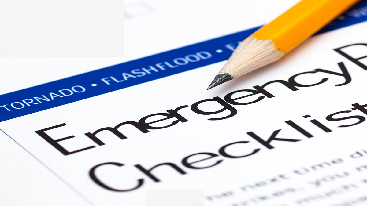 Paper form with a pencil on it has a heading of 'Emergency Checklist'. The words 'tornado' and 'flashflood' also appear.