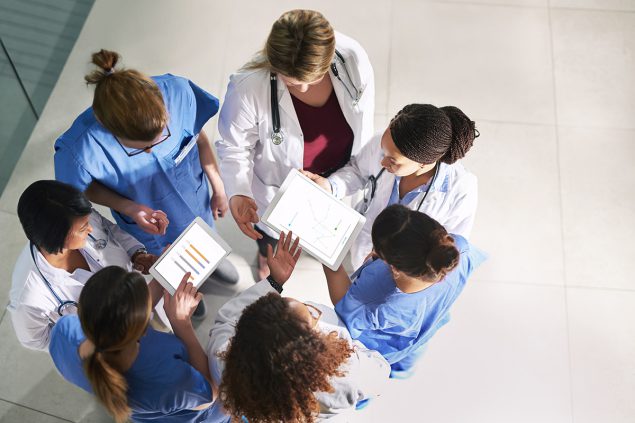 Healthcare professionals in a circle in active consult