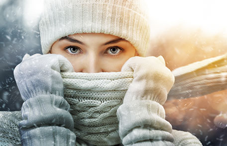 A woman dressed in warm winter clothing.