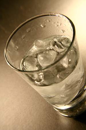 Glass of Water Glass of water with ice sitting on a table