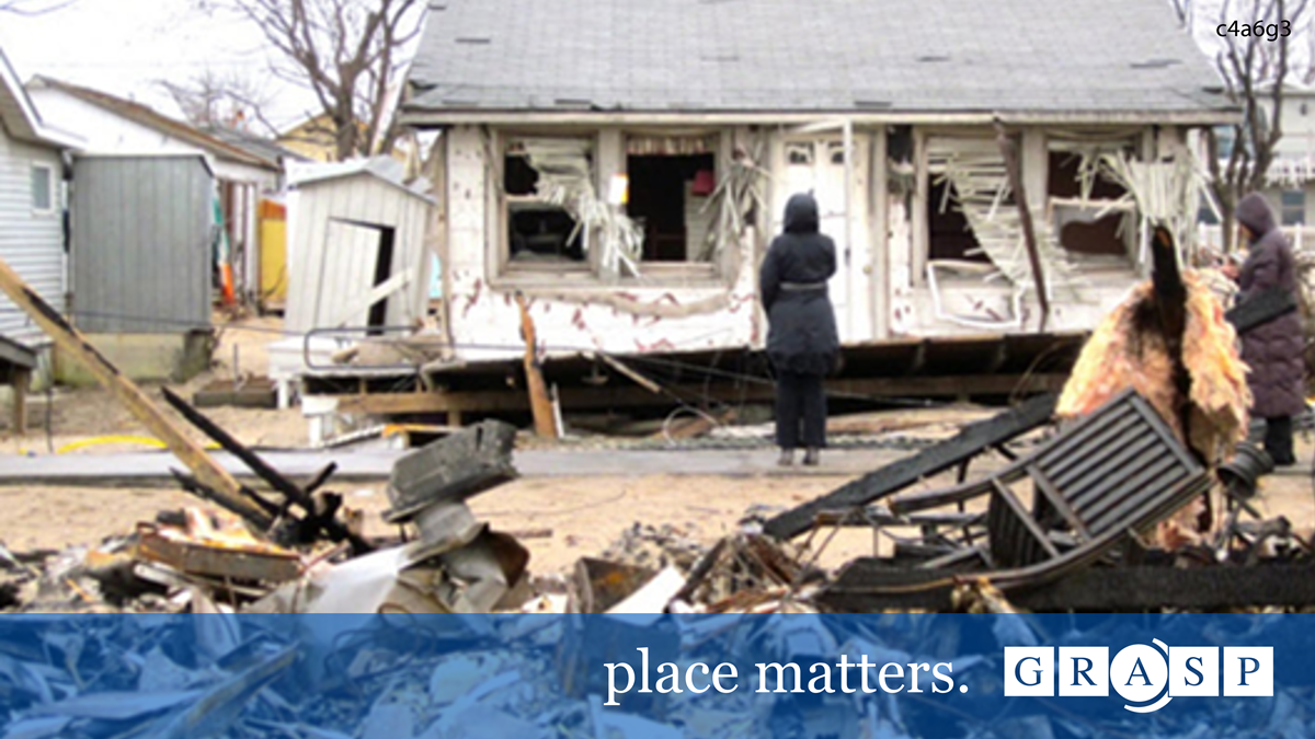 Image of person looking at a home impacted by a natural disaster