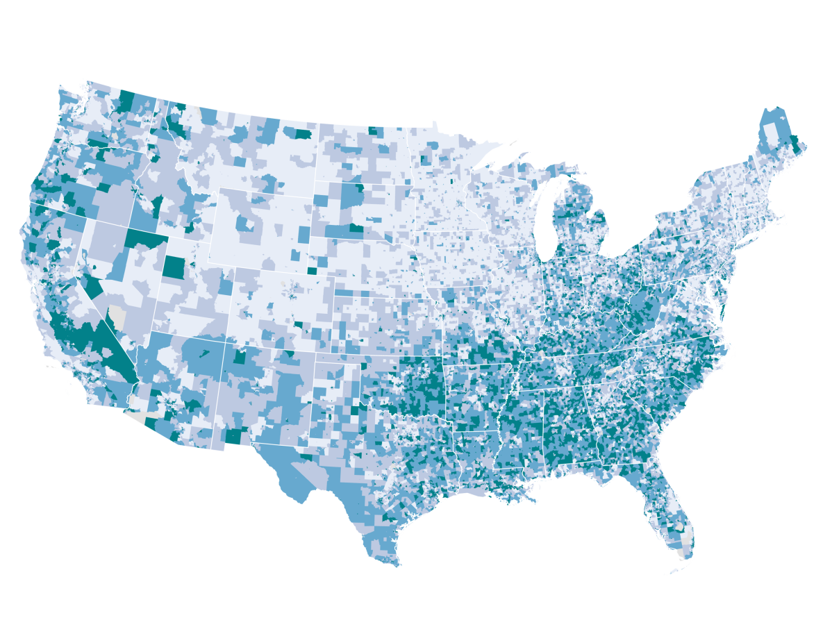 A map of the United States with blue population areas of high environmental justice impacts