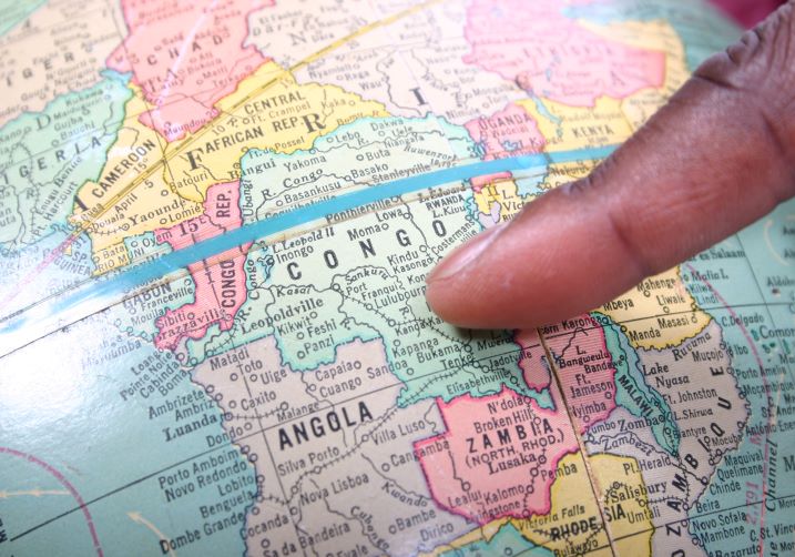 Finger pointing to The Congo on a map.