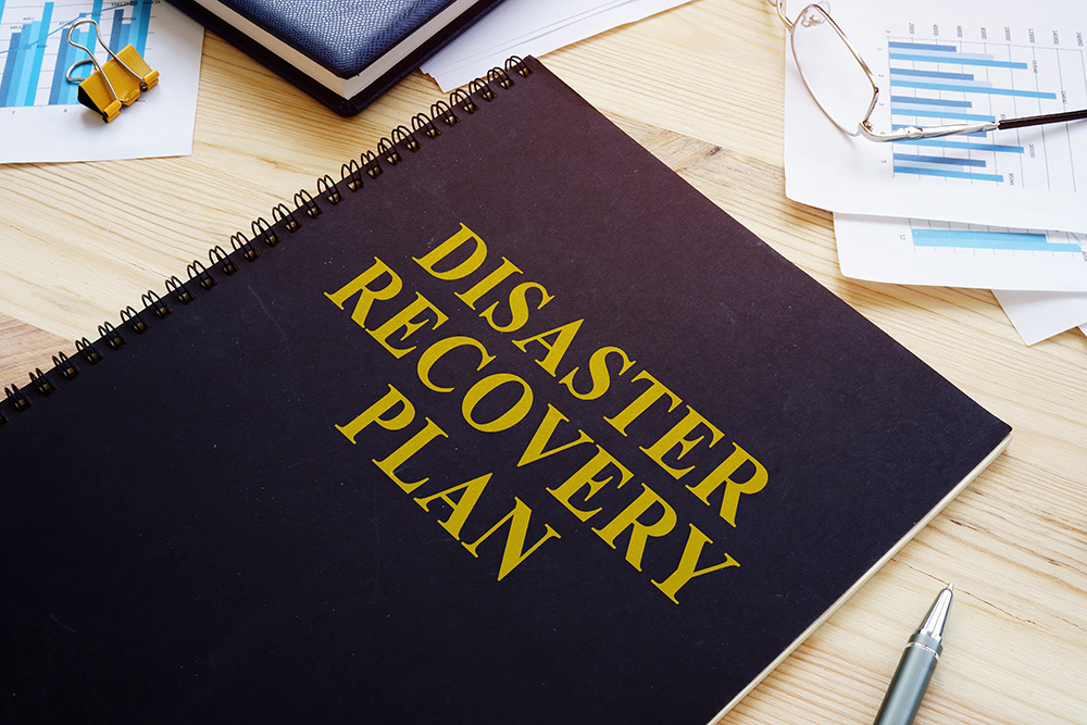Image showing disaster recovery planner, data sheets, and pen. 