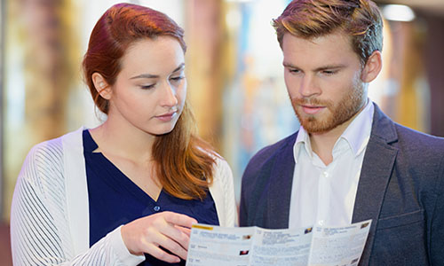 couple holding a brochure